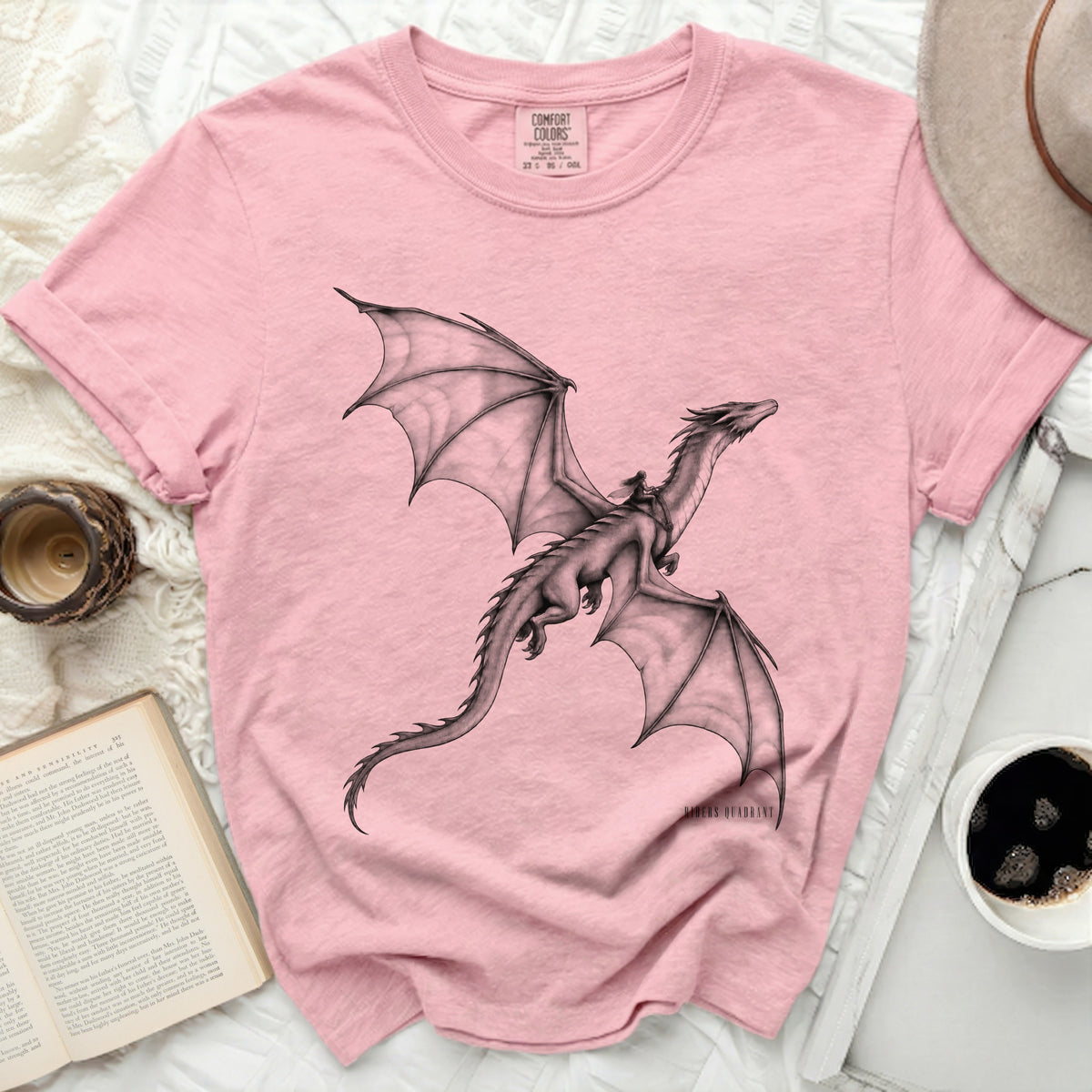 Pink t-shirt with a black and white drawing of a dragon and rider, "Comfort Colors" tag.