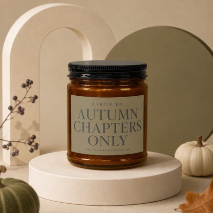 Amber candle with black lid labeled "Autumn Chapters Only".
