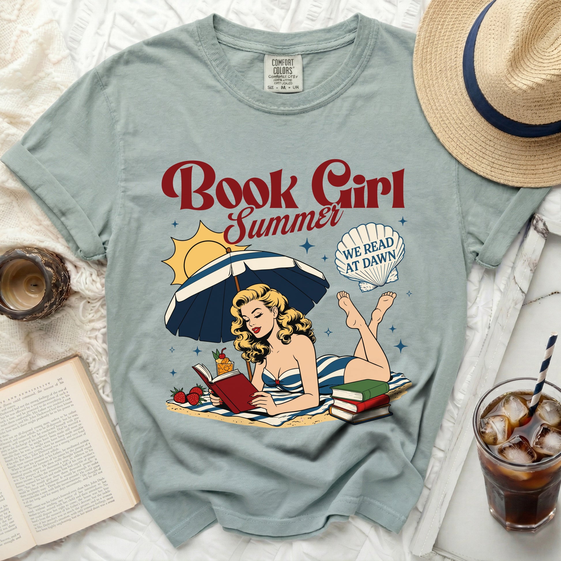 T-shirt with "Book Girl Summer" graphic of a woman reading on a beach.