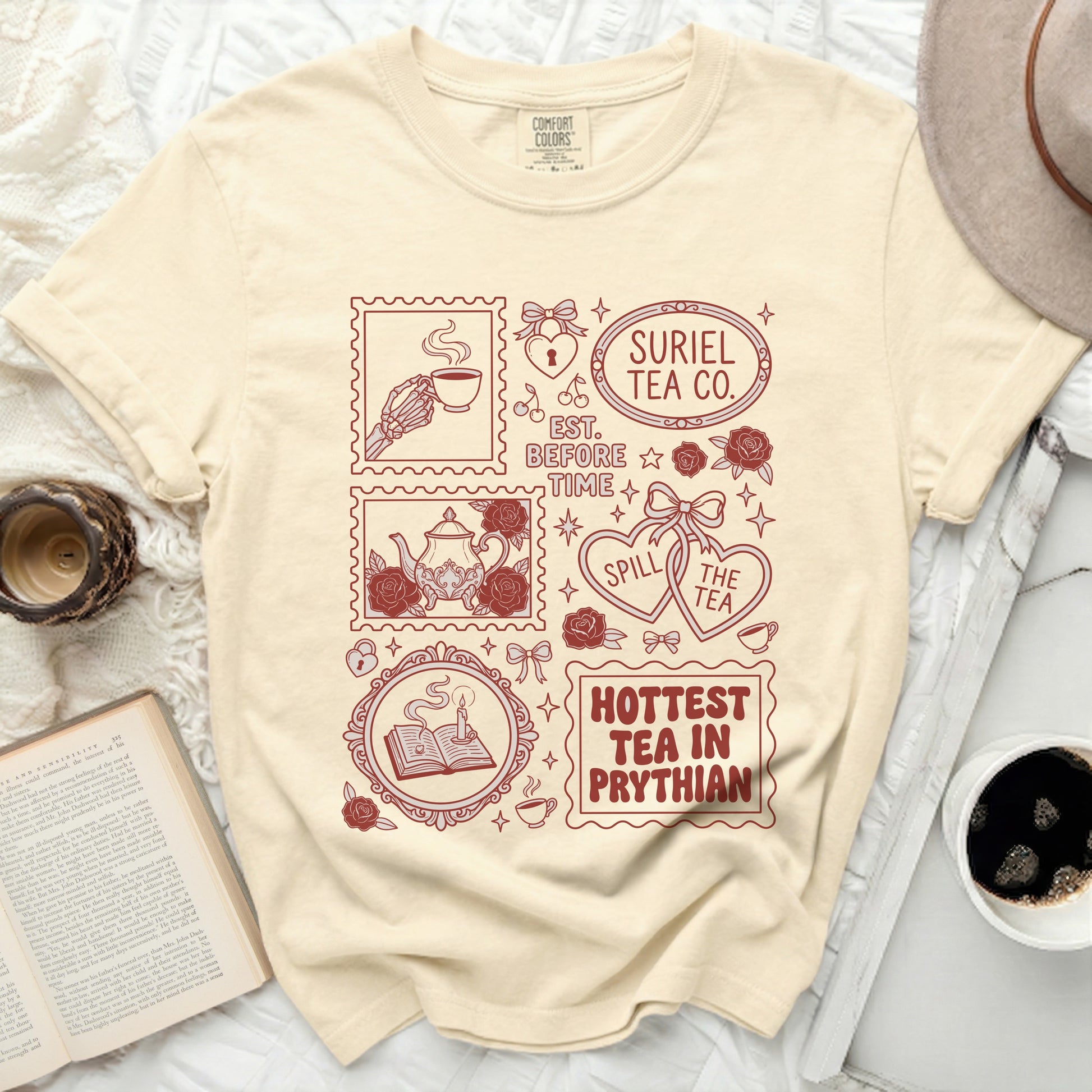 Cream t-shirt with "Suriel Tea Co. Est. Before Time" and other tea-themed graphics.