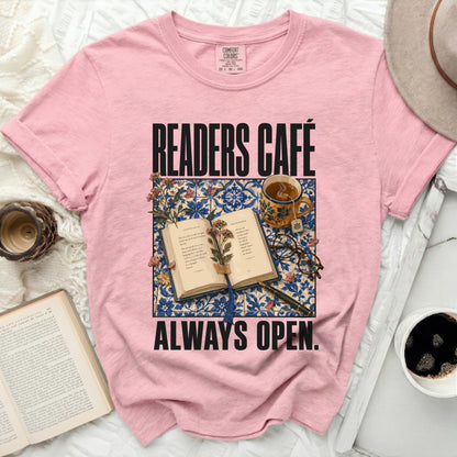 Pink t-shirt with "READERS CAFÉ ALWAYS OPEN" and an open book.