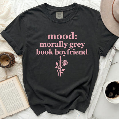 Black t-shirt with pink text "mood: morally grey book boyfriend" and sword and rose graphic.