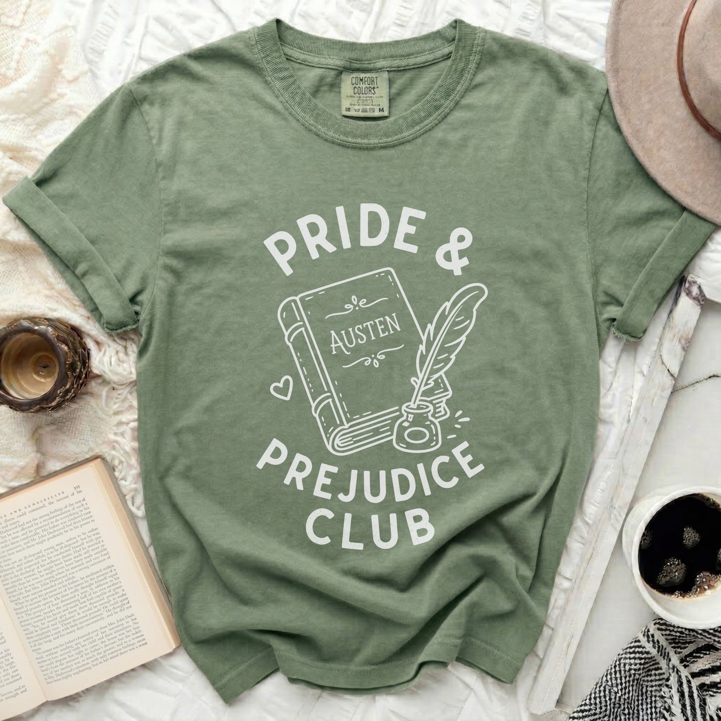 Green t-shirt with "Pride & Prejudice Club" and book graphic.