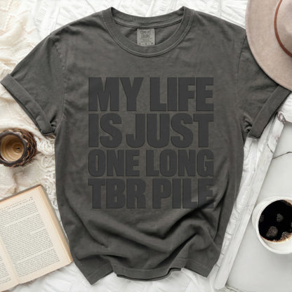 T-shirt with bold text "MY LIFE IS JUST ONE LONG TBR PILE."