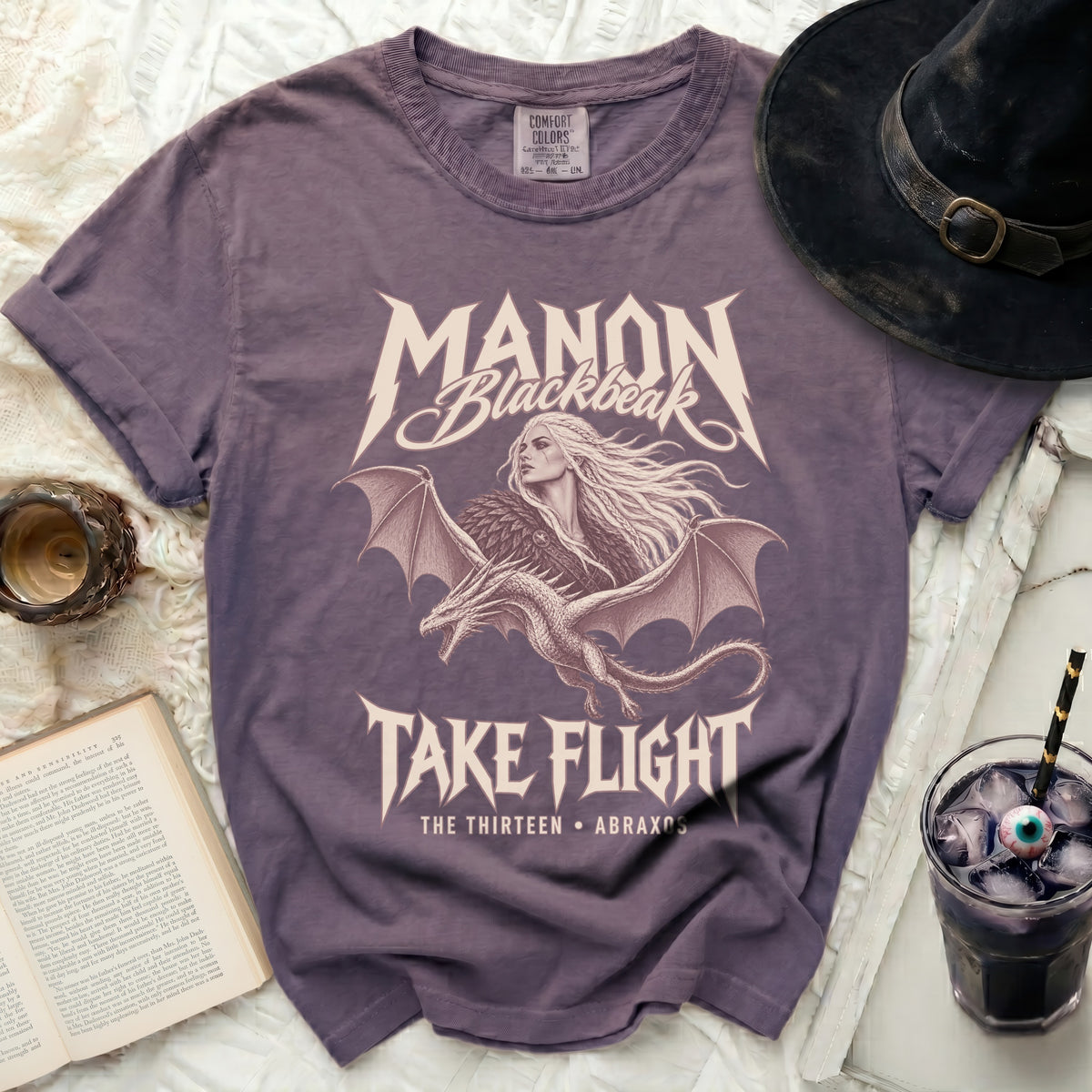 Purple t-shirt with "Manon Blackbeak Take Flight" design and dragon.