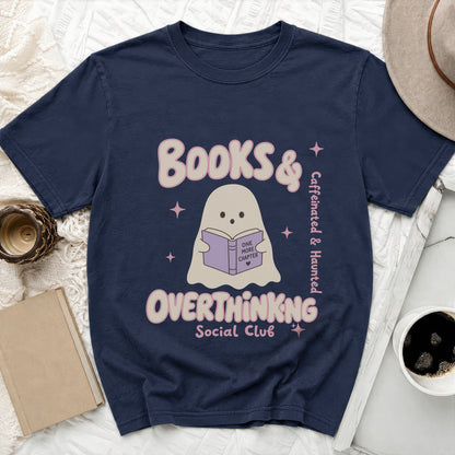 Dark navy t-shirt with ghost reading "One More Chapter" and text "Books & Overthinking Social Club."