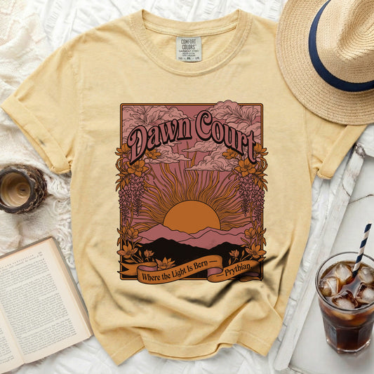 Yellow t-shirt with "Dawn Court" and "Where the Light Is Born – Prythian" graphic.
