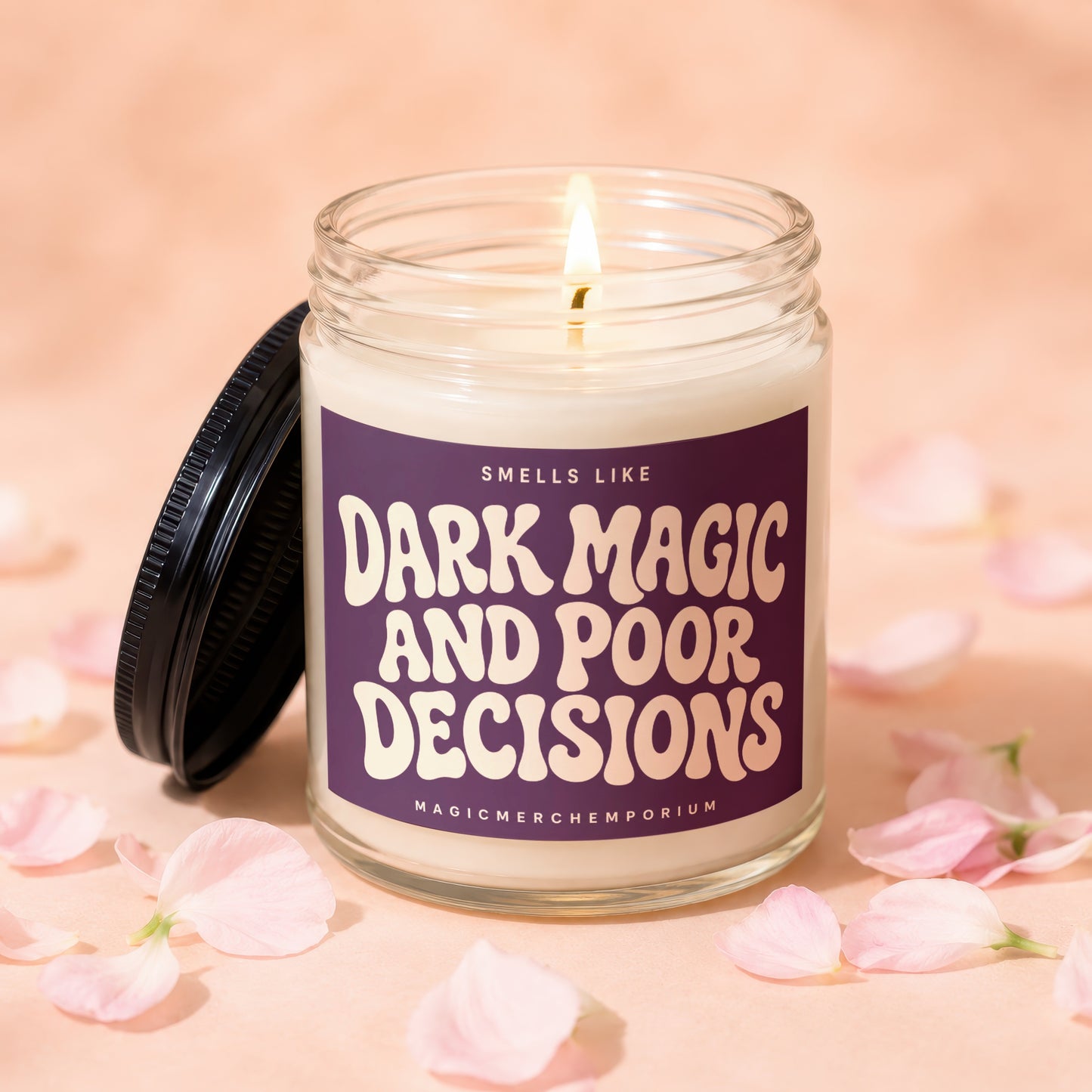 Candle with lid off, reading "Smells Like Dark Magic and Poor Decisions".
