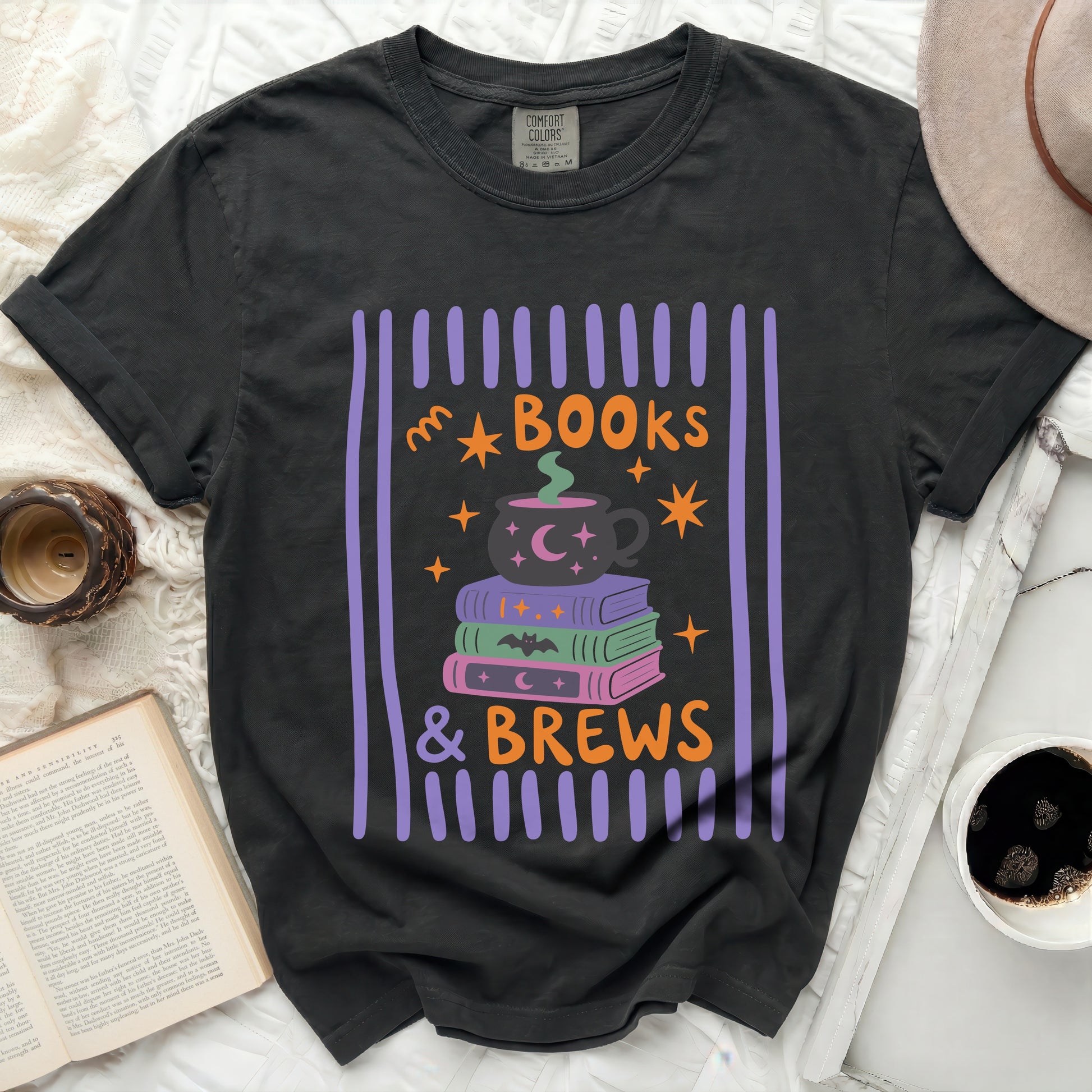 Black t-shirt with "Books & Brews" Halloween-themed graphic.