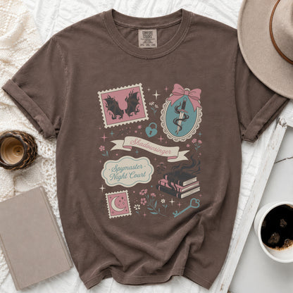 Brown t-shirt with "Shadowsinger Spymaster Night Court" text and fantasy illustrations.