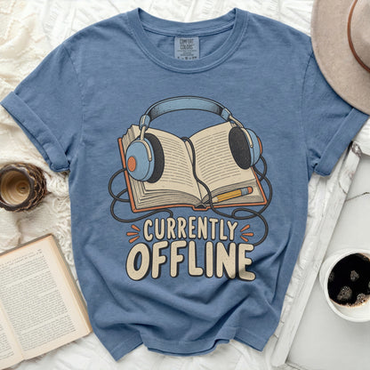 Blue t-shirt with "Currently Offline" graphic of headphones on an open book.