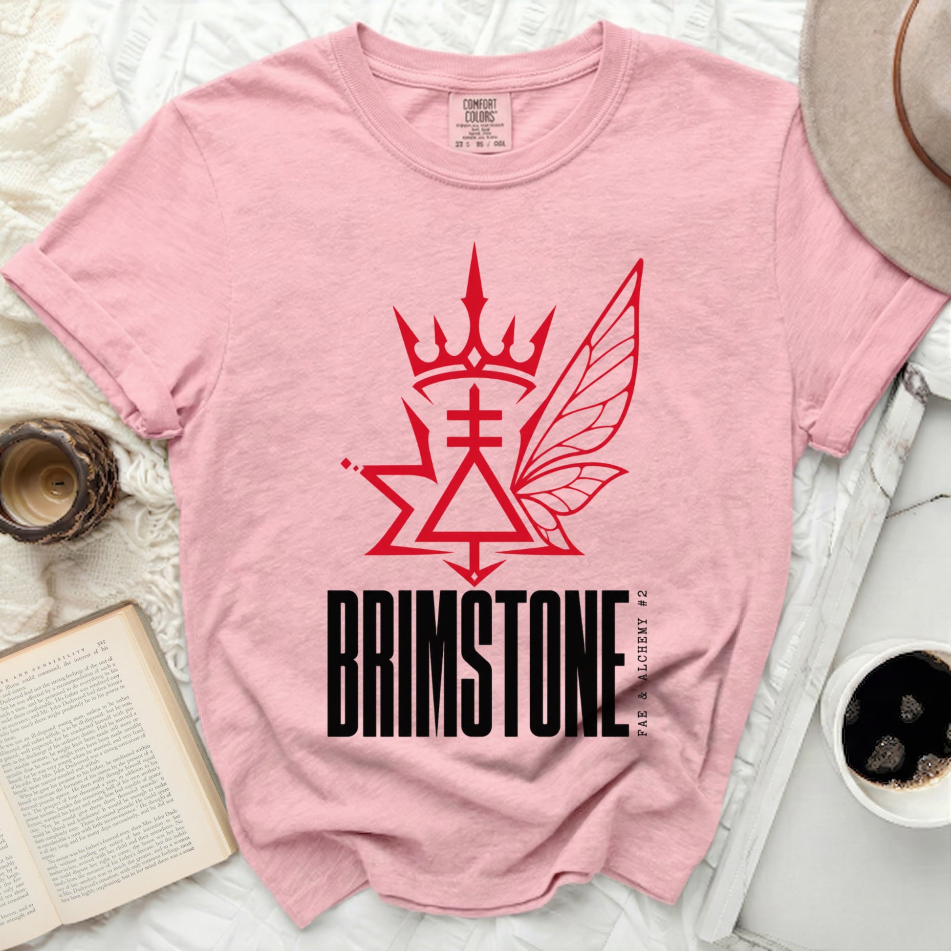 Pink t-shirt with "BRIMSTONE FAE & ALCHEMY #2" graphic.