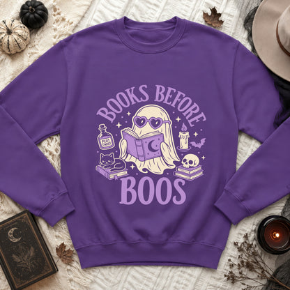 Purple sweatshirt with a ghost reading a book and the text "Books Before Boos".
