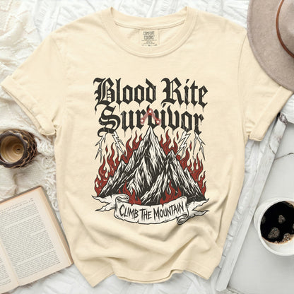 Cream t-shirt with "Blood Rite Survivor Climb The Mountain" graphic.