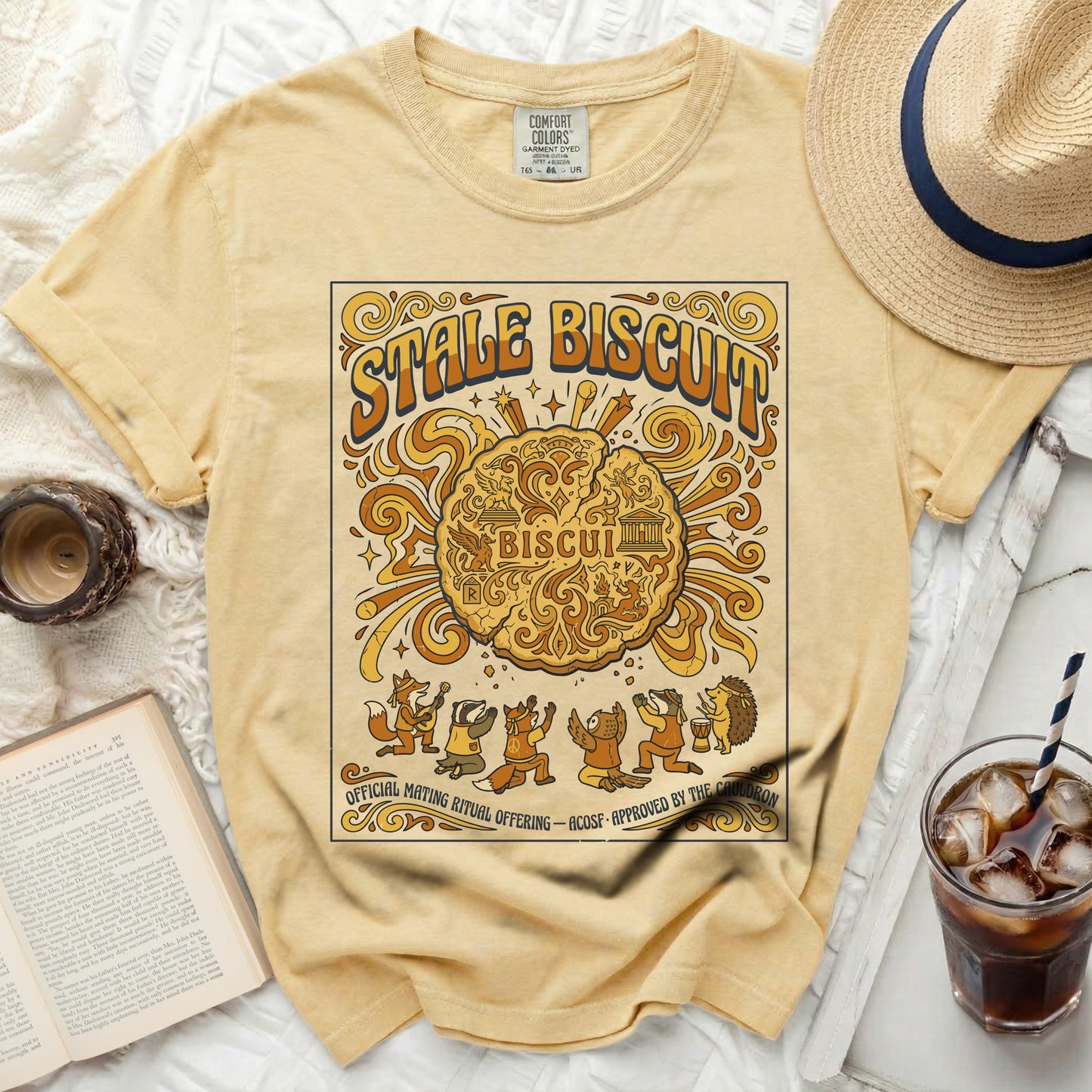 Yellow t-shirt with "Stale Biscuit" and anthropomorphic animals on the front.
