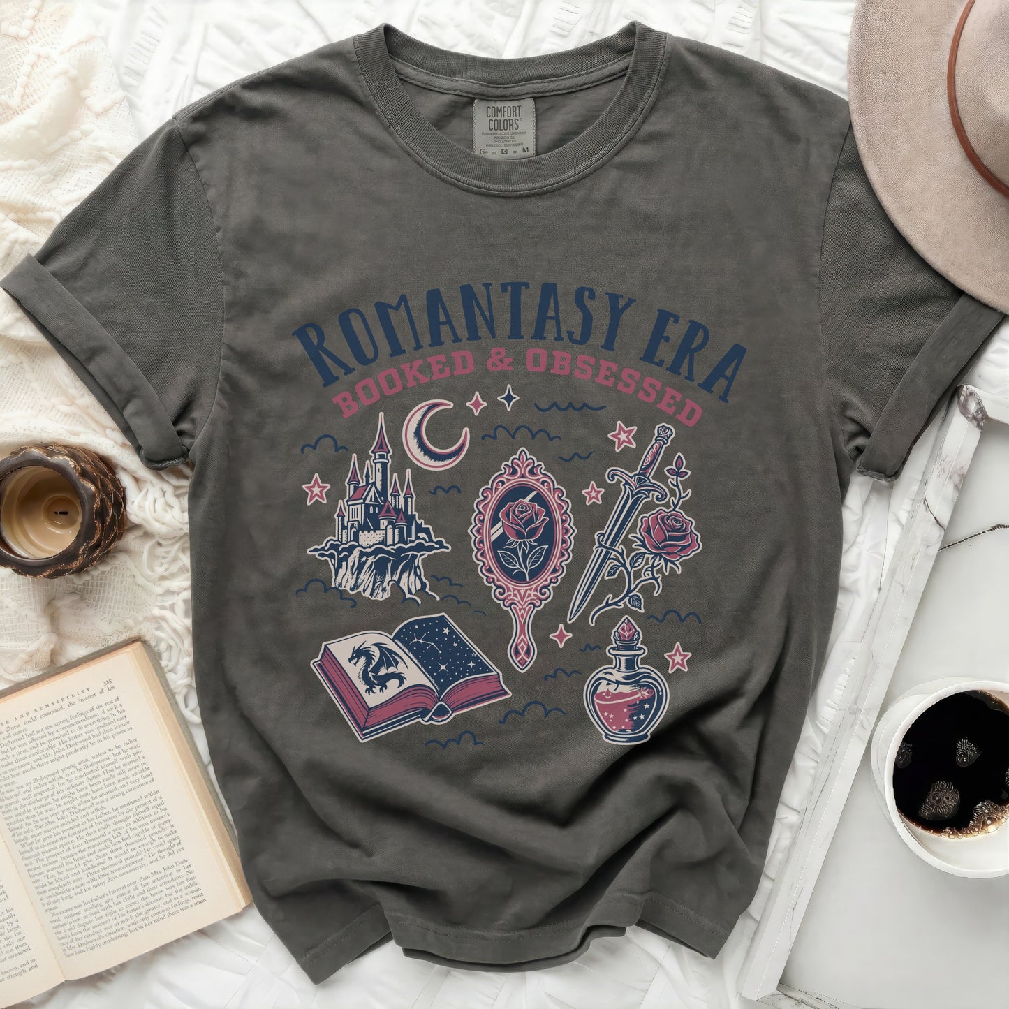 Olive green t-shirt with "Romantasy Era Booked & Obsessed" text and fantasy art.