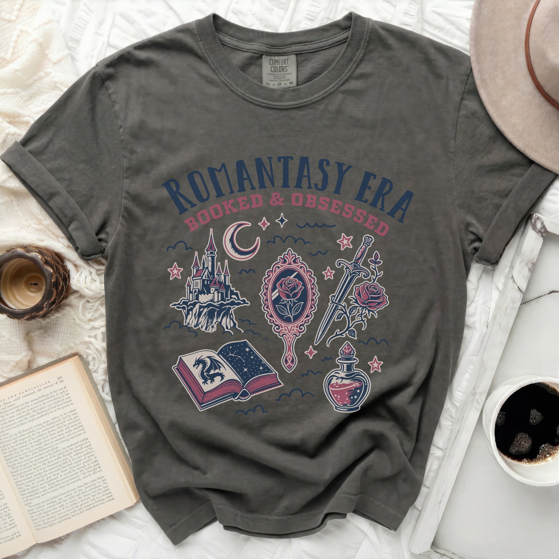 Olive green t-shirt with "Romantasy Era Booked & Obsessed" text and fantasy art.