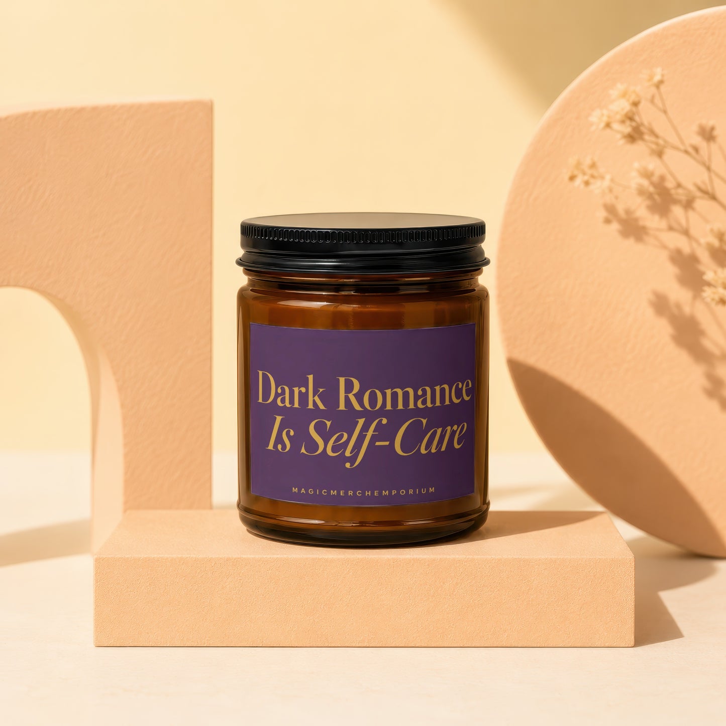 Amber jar candle with purple label reading "Dark Romance Is Self-Care."