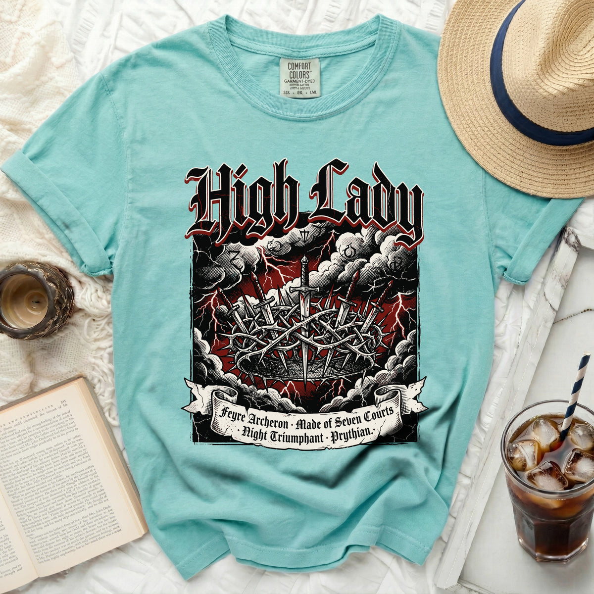 Aqua t-shirt with "High Lady" text and thorn crown graphic.