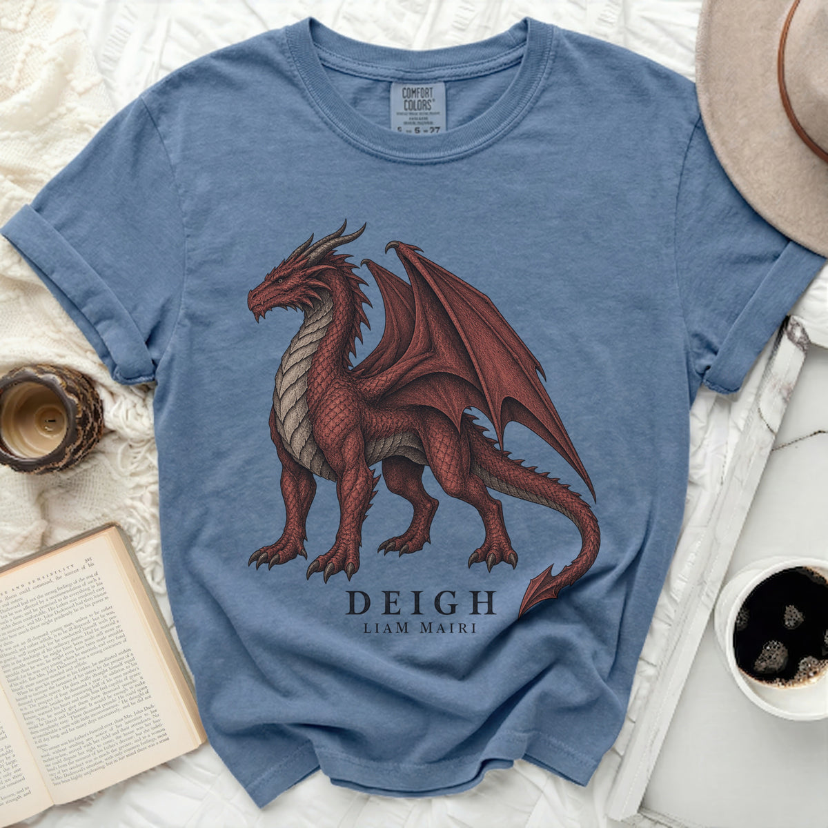 Blue t-shirt with a red dragon graphic, text "DEIGH LIAM MAIRI".