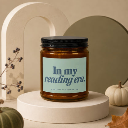 Amber candle with black lid and label reading "In my reading era."
