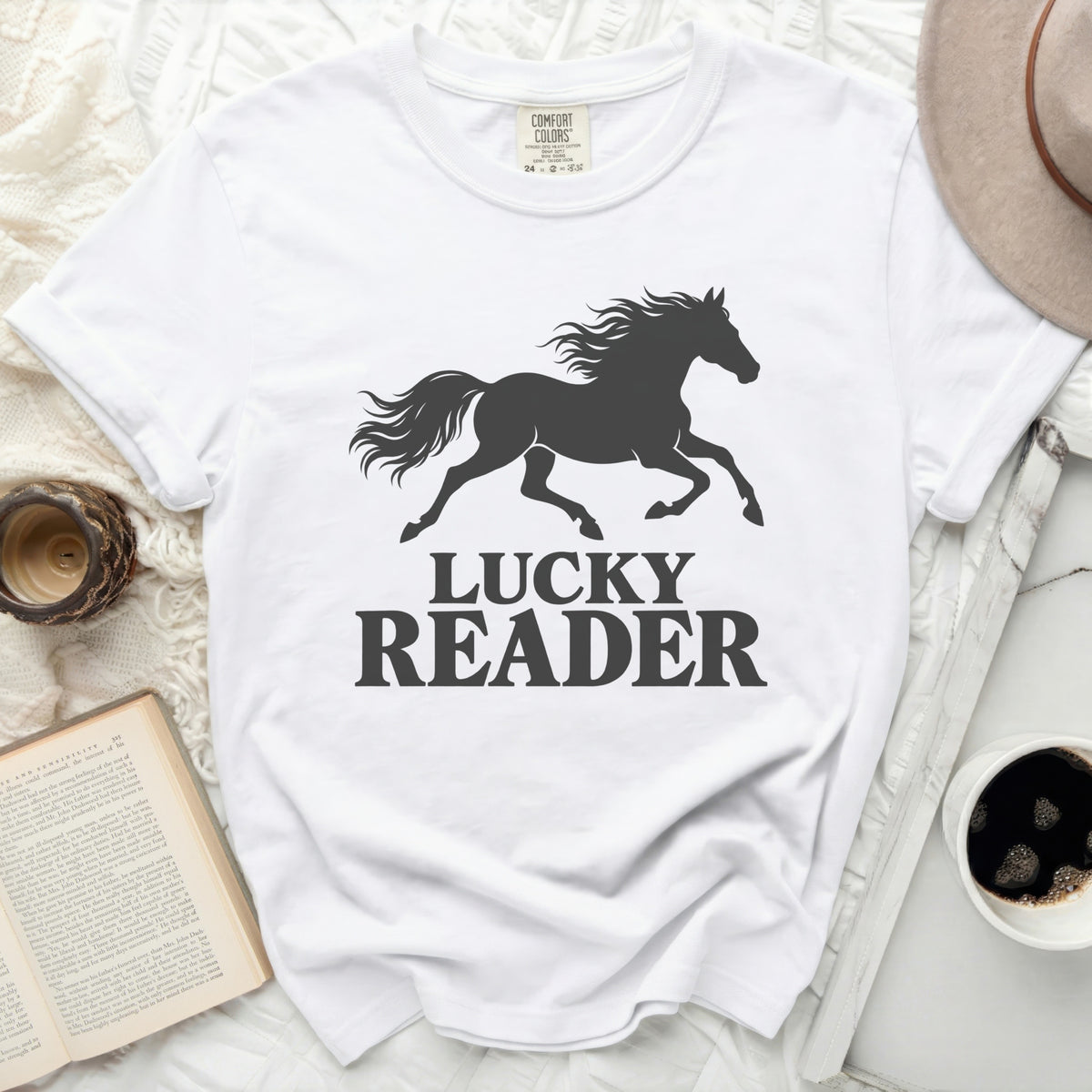 White t-shirt with black running horse and "LUCKY READER" text.