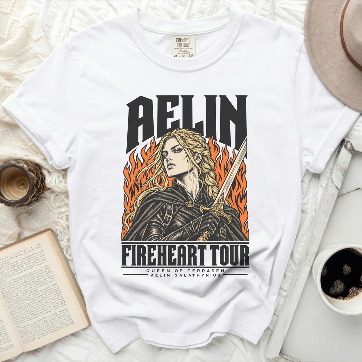White t-shirt with "AELIN" and "FIREHEART TOUR" graphics.