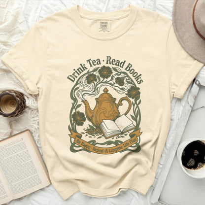Cream t-shirt with "Drink Tea • Read Books" and a teapot graphic.