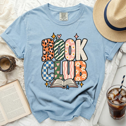Light blue t-shirt with "BOOK CLUB" graphic featuring an open book and stars.