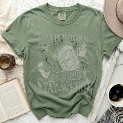 Green t-shirt with "Read Books, Be Kind, Stay Weird" text and graphic.