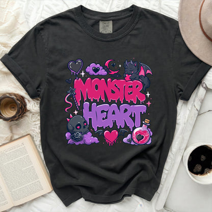 Black t-shirt with pink and purple monster heart graphic and text.