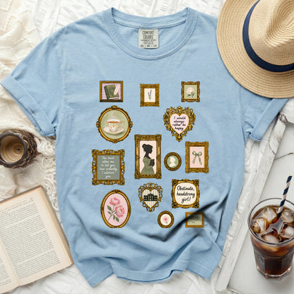 Light blue t-shirt with gold-framed vintage illustrations and text.