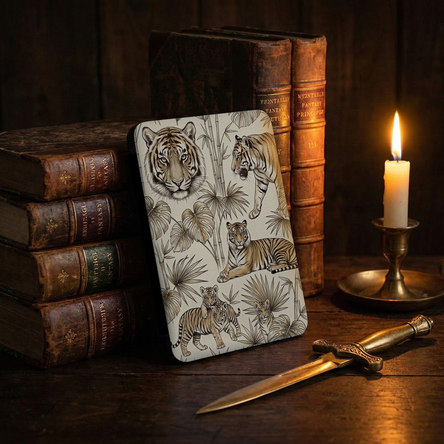 Device with tiger art, antique books, lit candle, and dagger.