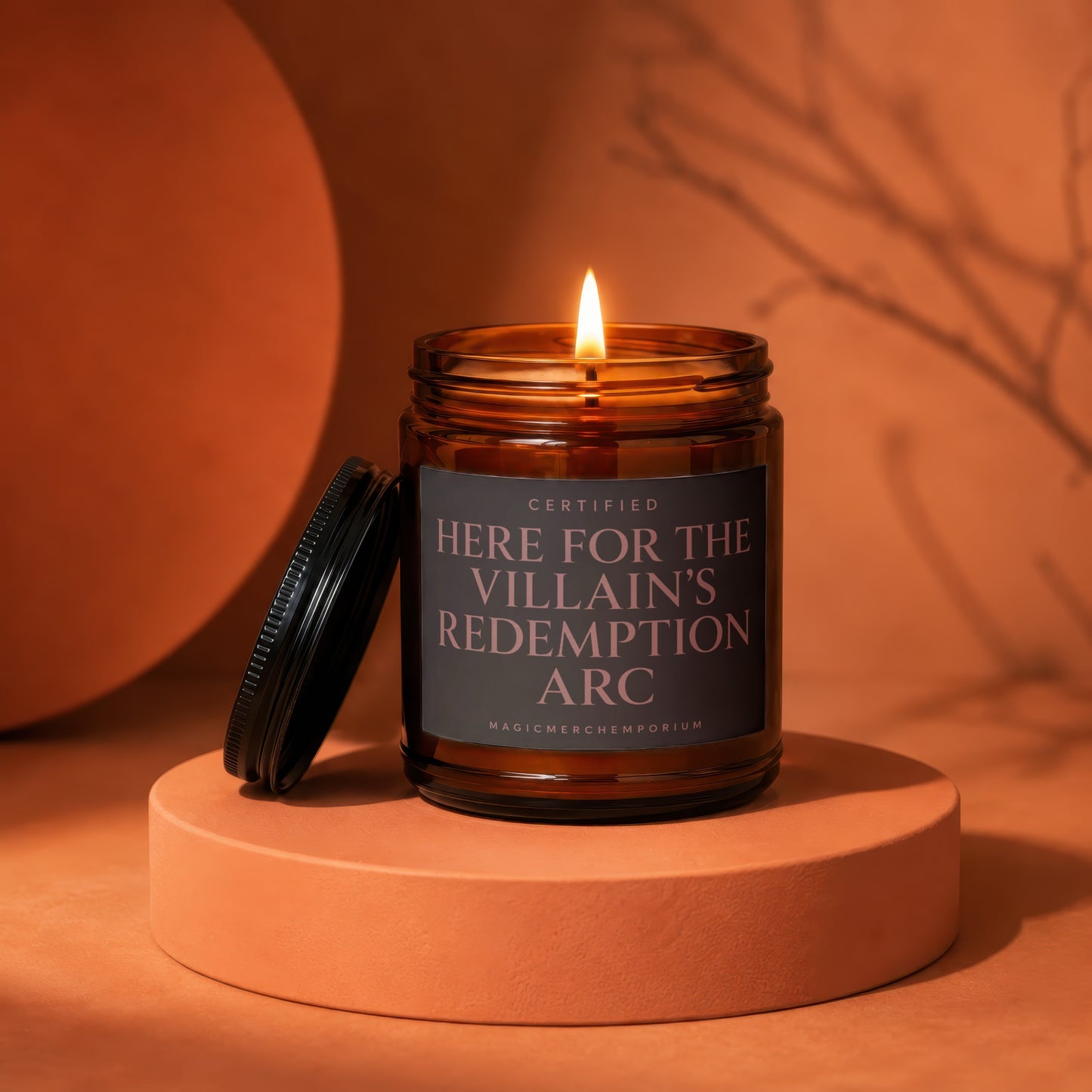 Amber jar candle with lid off; "Certified Here for the Villain's Redemption Arc" text.