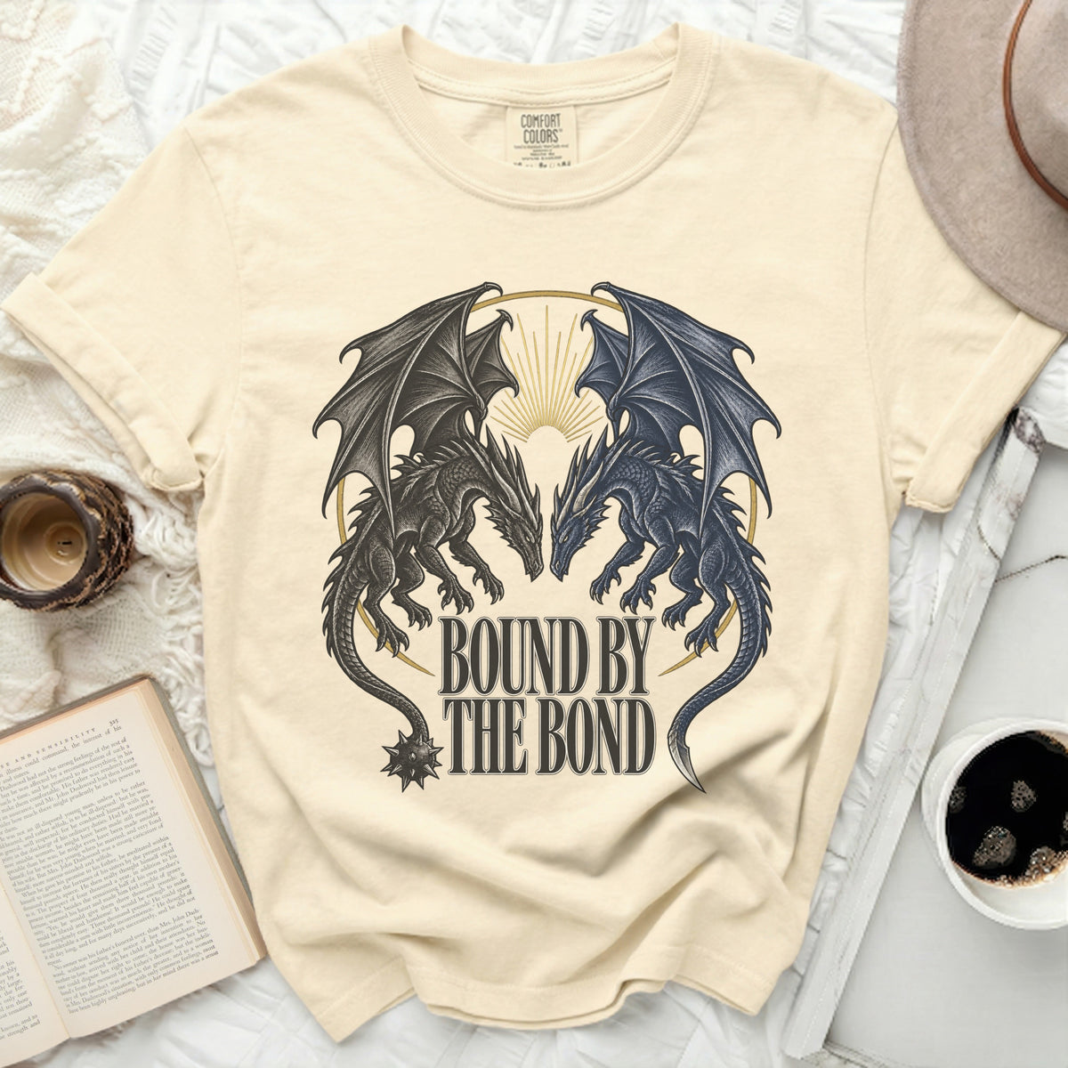 Cream t-shirt with two dragons facing each other, text "Bound by the Bond."