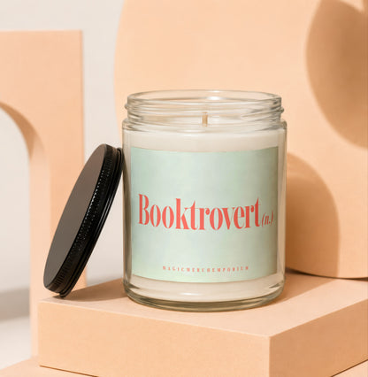 Glass candle with "Booktrovert (n.)" text and "MAGICMERCH`EMPORIUM" below.