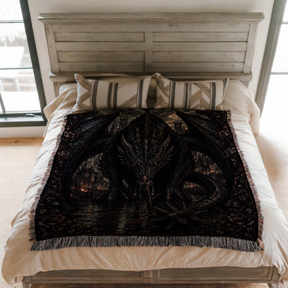 a bed with a large, intricate dragon-themed blanket or throw covering the bed. The bed has a wooden headboard and white bedding.