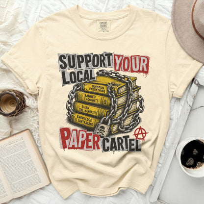 T-shirt with stacked books graphic and "Support Your Local Paper Cartel" text.