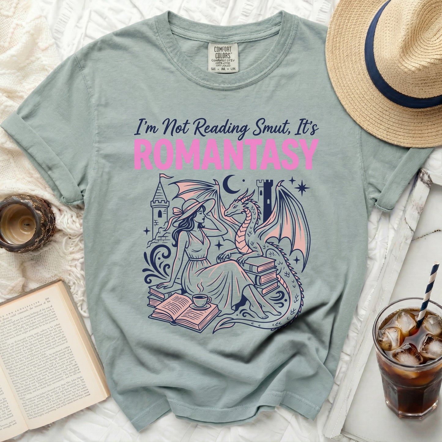 Light blue t-shirt with "I'm Not Reading Smut, It's ROMANTASY" text and dragon design.