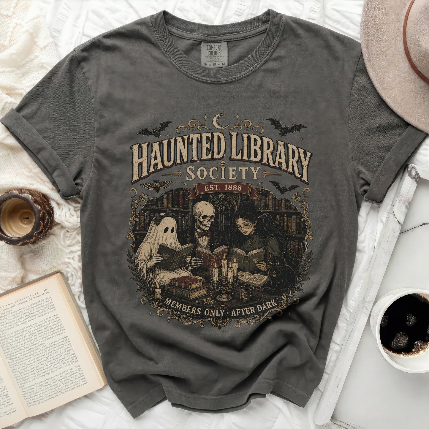 Haunted Library Society graphic tee with ghost, skeleton, and witch reading books.