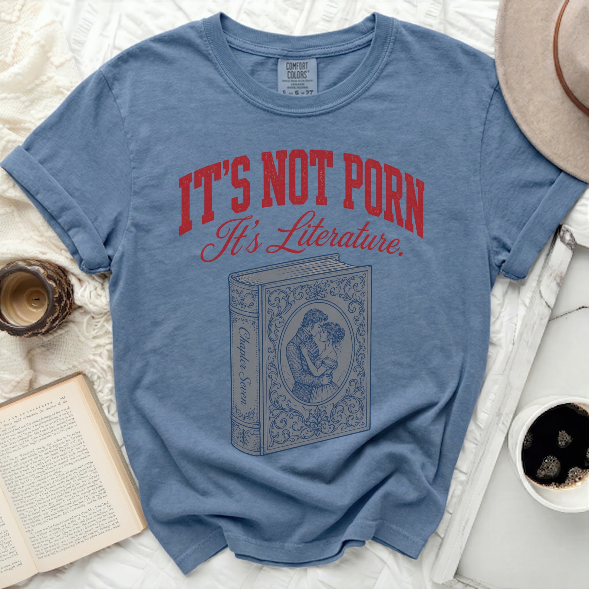 Blue t-shirt with "It's Not Porn It's Literature" and a book illustration.