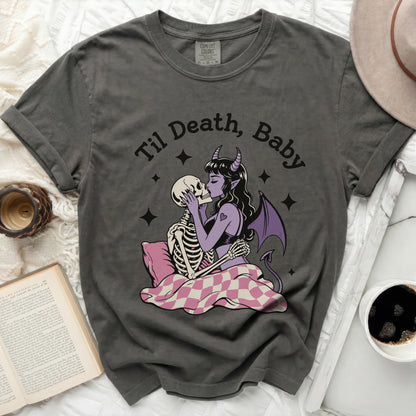 T-shirt with "Til Death, Baby" graphic of skeletons kissing and a devil.