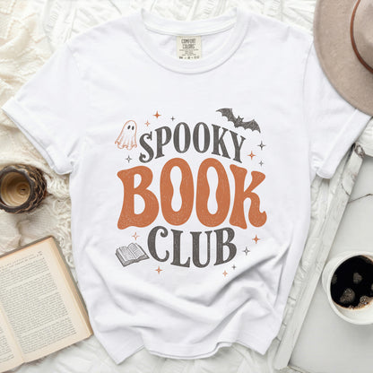 White t-shirt with "Spooky Book Club" graphic, ghost, bat, and open book.