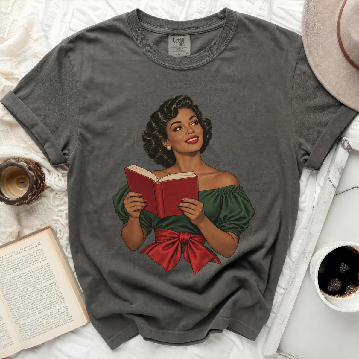 Dark grey t-shirt with vintage illustration of a woman reading a book.