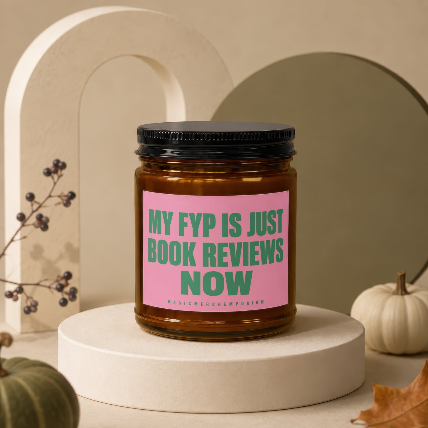 Amber jar candle with pink label reading "MY FYP IS JUST BOOK REVIEWS NOW".