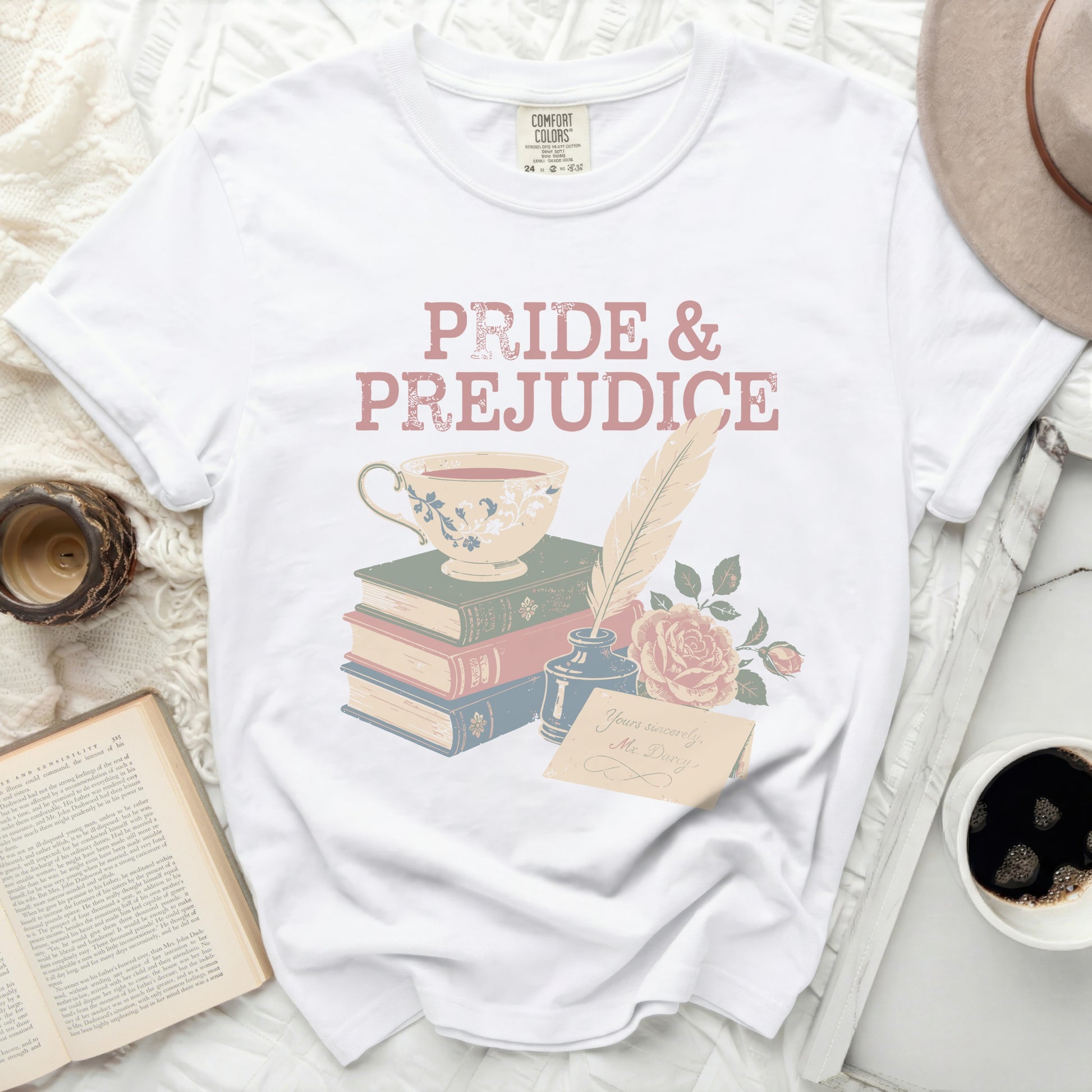 White t-shirt with Pride and Prejudice graphic and a teacup.