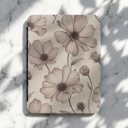 Notebook with sepia watercolor floral pattern on a marble surface.