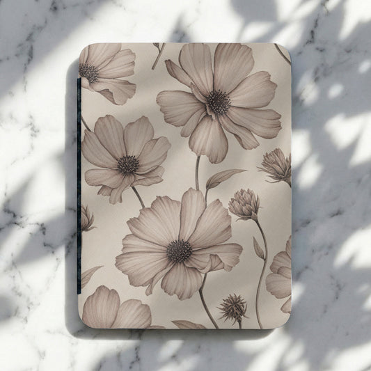 Notebook with sepia watercolor floral pattern on a marble surface.