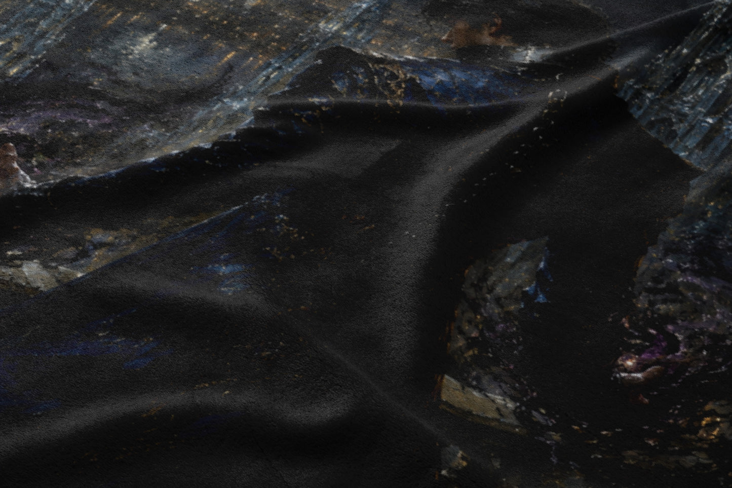 Dark fabric with an abstract, textured pattern of dark blues, grays, and gold.