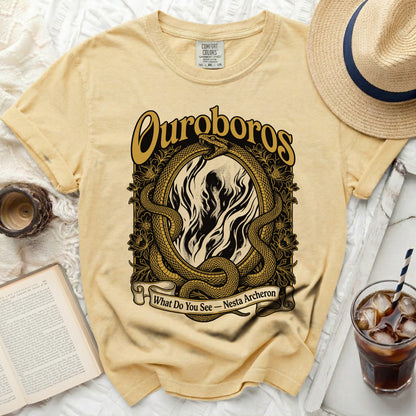 Yellow t-shirt with Ouroboros and text "What Do You See - Nesta Archeron."